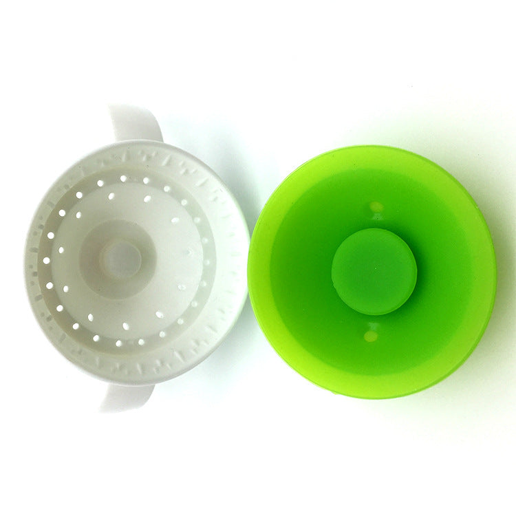 Green silicone 360 baby cup on a white background