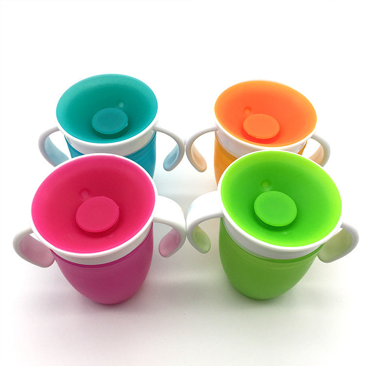 Four colorful 360 baby cups with lids on a white background