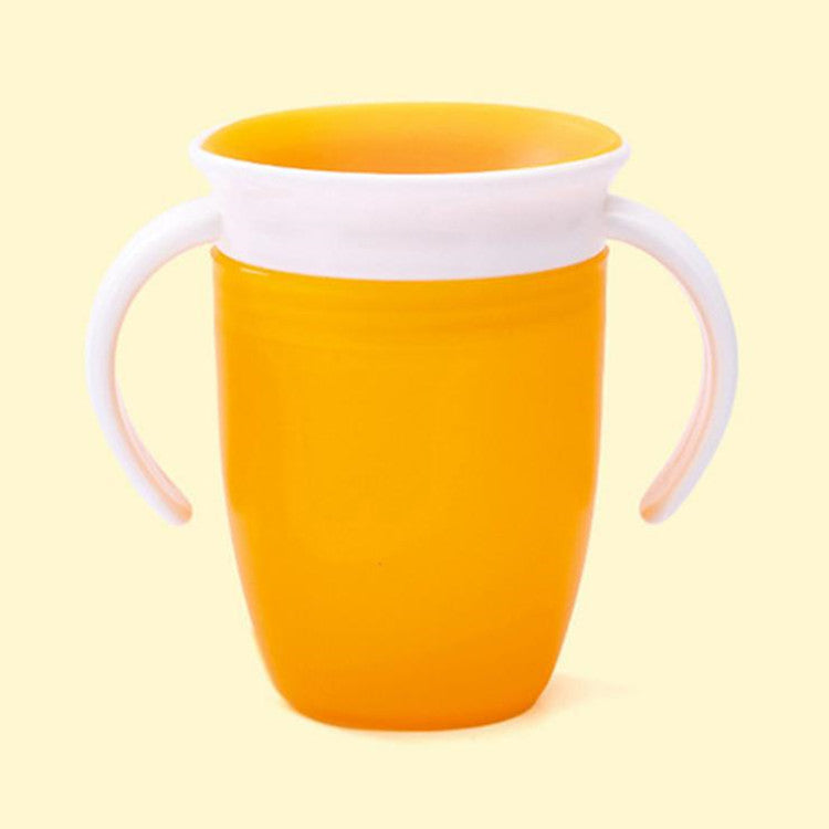 Orange cup with white handle and rim on a light yellow background