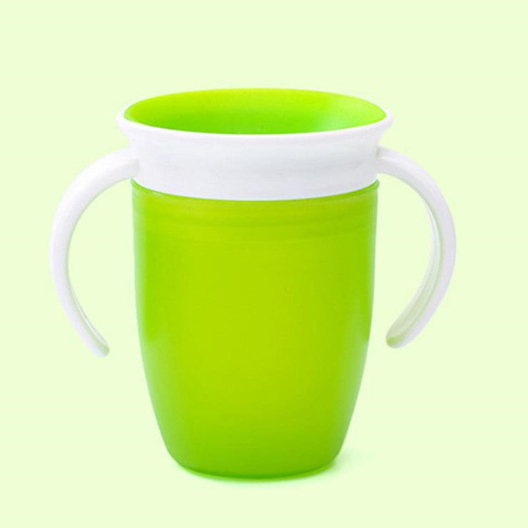Green cup with white handle and rim on a light green background