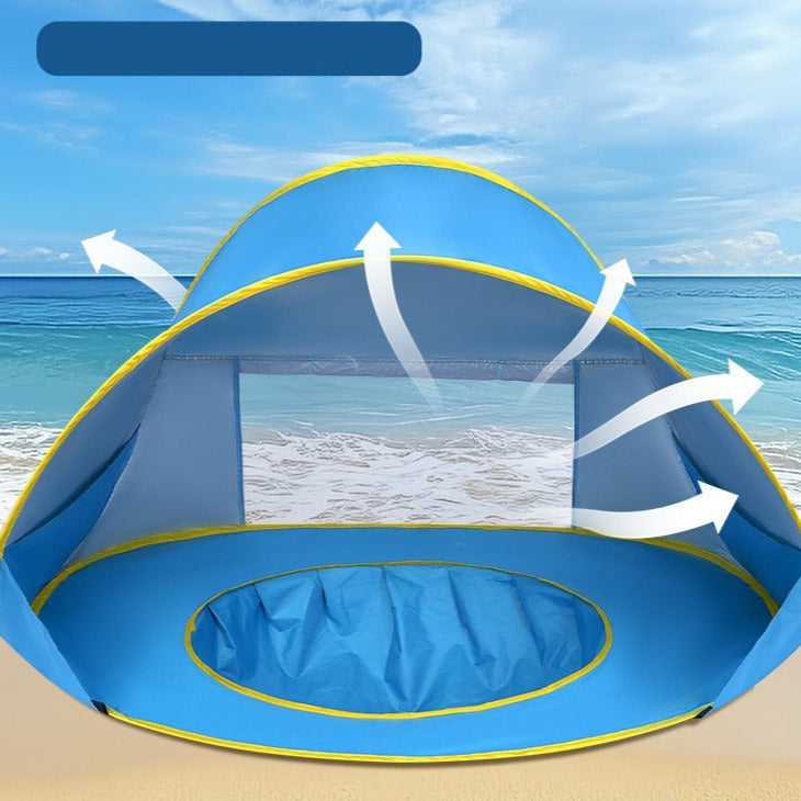 Blue beach tent with open window design on a sandy beach with ocean view